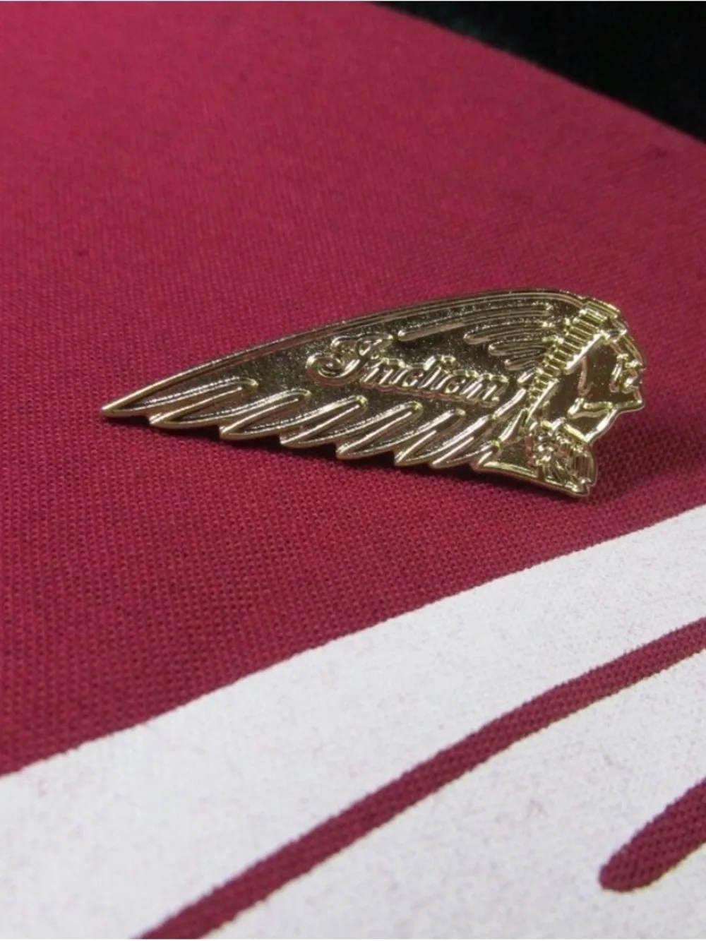 Gold Tone Winged Indian “Chief” Logo Pin - Gold Tone. NEW IN ORIGINAL PKG.